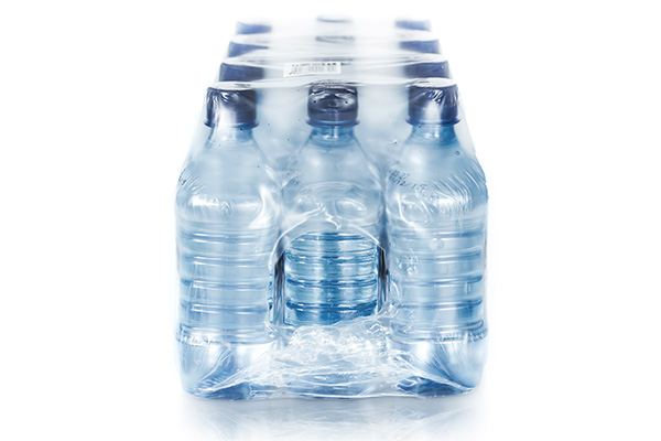 Plastic bottles shrink-wrapped with Lucofin film