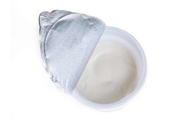 Opened yoghurt packaging made from Lucofin
