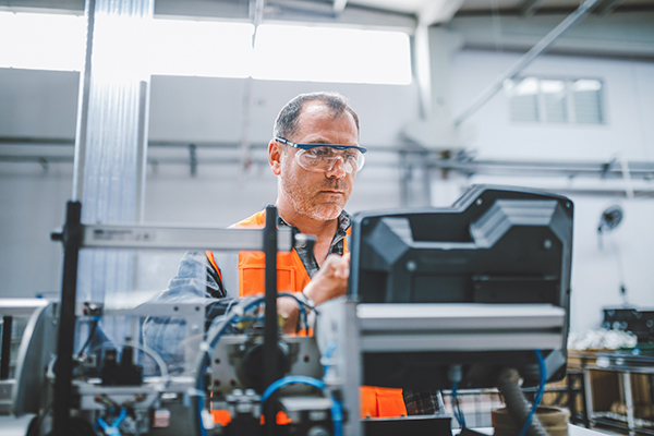 Man at an electrical station which is insulated by thermoplastic polyolefins