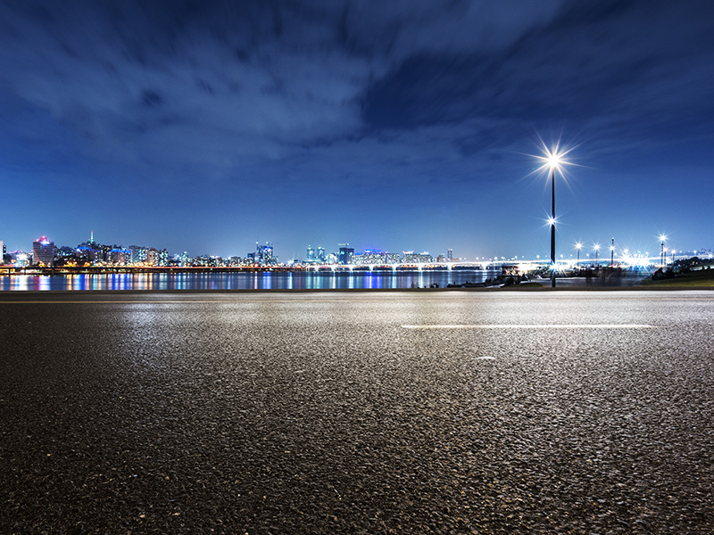 Asphalt road optimized by Lucowax with skyline in the background